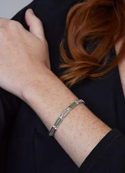 Close up shot of red haired model wearing Sterling Silver Connemara Marble Celtic Link Bracelet